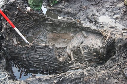 Image showing excavation of wicker trough found during archaeological excavations